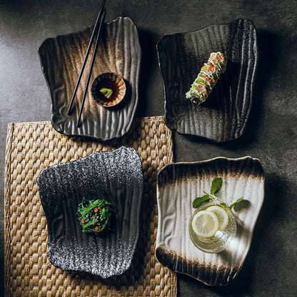 White ceramic sushi plate with chopstick holder and soy sauce wells
