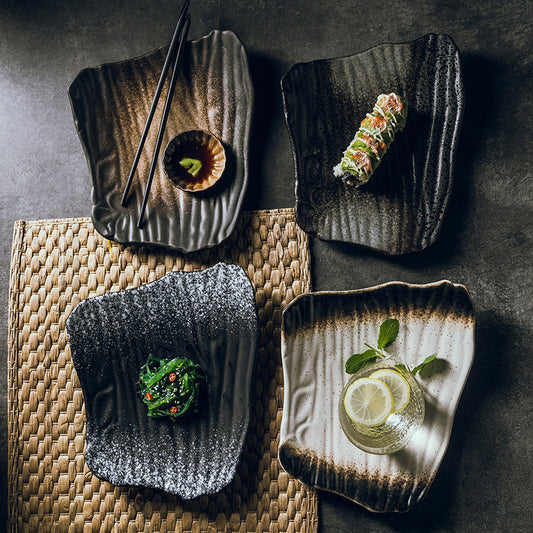 White ceramic sushi plate with chopstick holder and soy sauce wells
