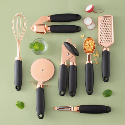 7-piece copper kitchen utensils arranged on marble counter