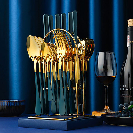 Gold 24-piece cutlery set displayed on storage rack