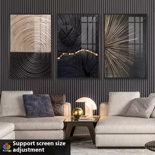 Black and gold abstract triptych canvas art on white wall"
